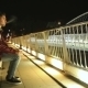 Young Man Smoking Cigarette On a Bridge At The Night - VideoHive Item for Sale