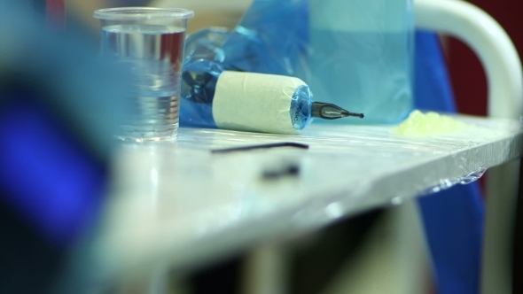 Tattooer Showing Process Of Making A Tattoo