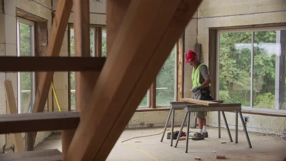 Construction worker inside home working