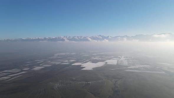 Aerial drone shot over famous Fagaras mountains covered with snow in wintertime