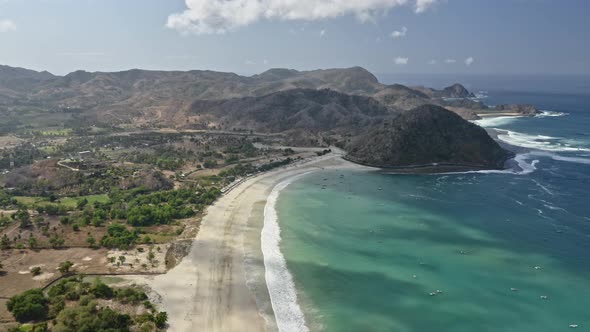 Trees By the Seashore with Boats Along the Ocean Waters in Lombok, Indonesia alt