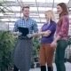 Young Florist Serving Customers In Greenhouse - VideoHive Item for Sale