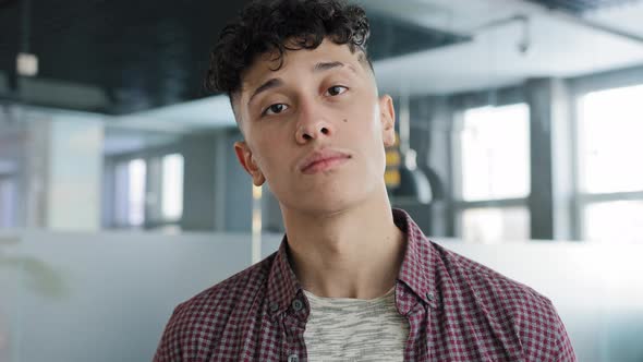Male Portrait Young Confident Proud Hispanic Guy Looking at Camera Standing Indoors Serious Novice alt