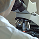 Researcher Viewing Through Microscope - VideoHive Item for Sale