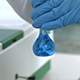 Researcher Take Samples Liquid in Flask in Lab - VideoHive Item for Sale