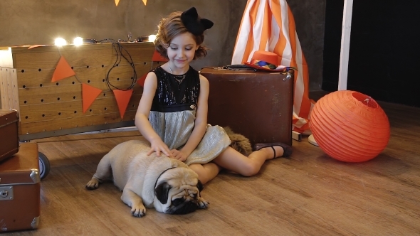 Little Girl Sitting Near Retro a Suitcase With Dog. alt