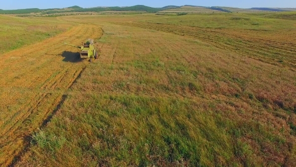 AERIAL VIEW. Combine Harvester Cutting Field