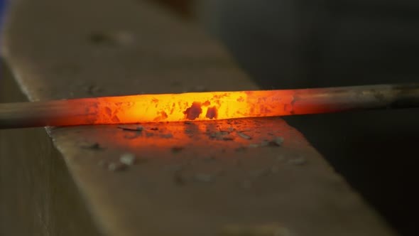 Blacksmith Forges Iron In The Forge