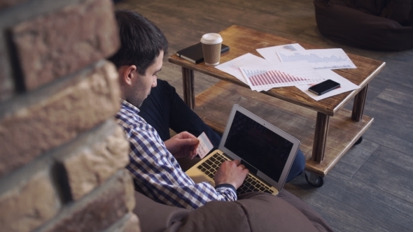 Man With a Laptop And a Credit Card To Pay The Bill. alt