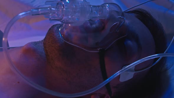 Move Seriously Injured Patient Lying on a Stretcher Through Hospital Corridors. Medical Staff in a alt