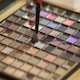 Woman Dabs a Small Brush into a Makeup Palette Woman Dabs a Small Brush into a Makeup Palette - VideoHive Item for Sale