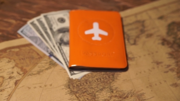 Passports And Money Over Map Background