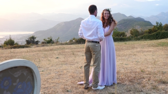 The Bride And Groom Posing On The Sunset  alt