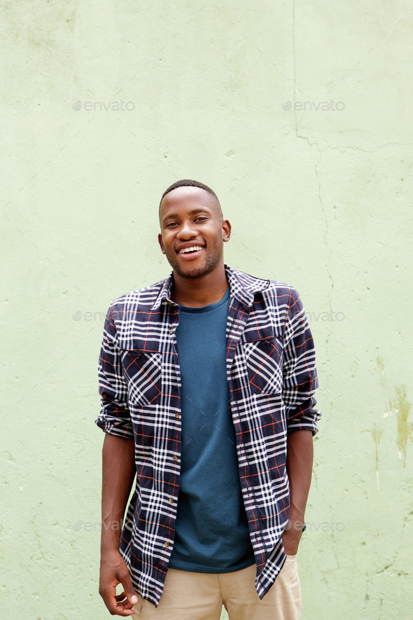 Cool young african guy smiling Stock Photo by mimagephotography