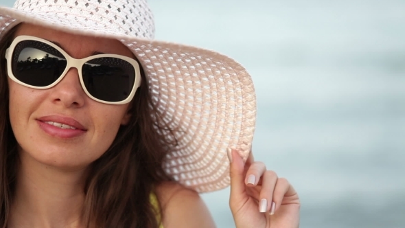 Beautiful Woman In Sunglasses And Big Hat Enjoying On Sea