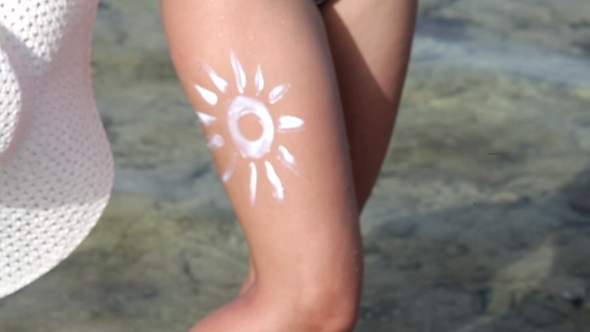 Woman With Painted White Sun On Her Body