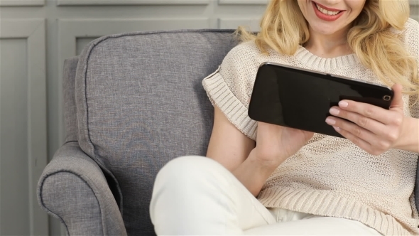  Girl In a Chair With The Tablet alt