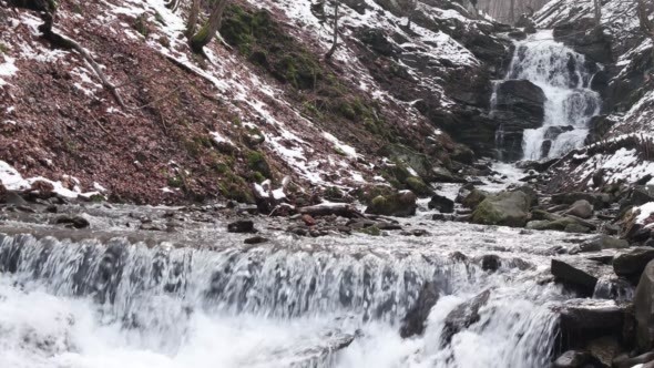 Fast Flowing Water in a Waterfall During Winter alt