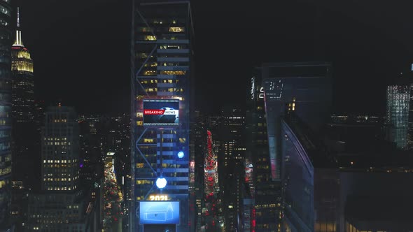 Aerial Descending Footage of High Rise Downtown Buildings at Night alt