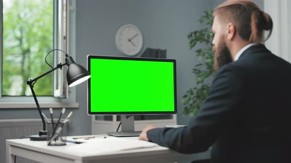 Businessman with Green Screen Computer