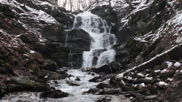 Fast Flowing Water in a Waterfall During Winter