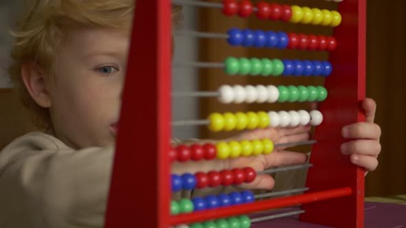 Cute Blond Boy Learning Counting.