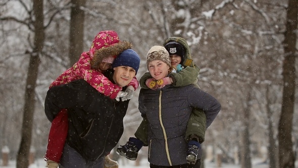 Happy Family During a Snowfall alt