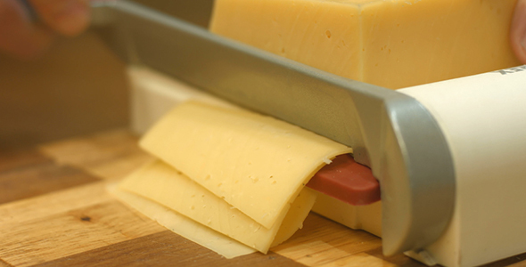 Slicing Cheese in the Kitchen
