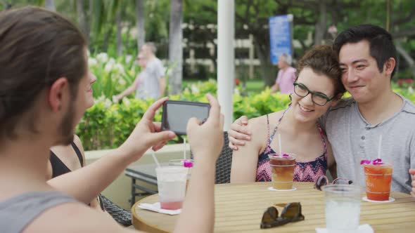 Group of friends in Hawaii taking photos of each other