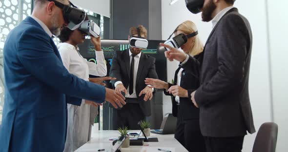 International Business Partners which Working Together Applying Virtual Reality Headset alt