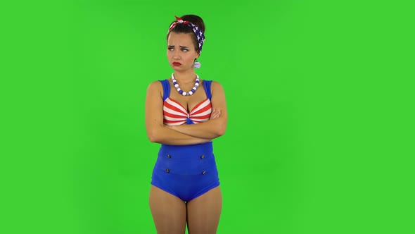 Beautiful Girl in a Swimsuit Is Very Offended and Looking Away Then Smiling. Green Screen alt