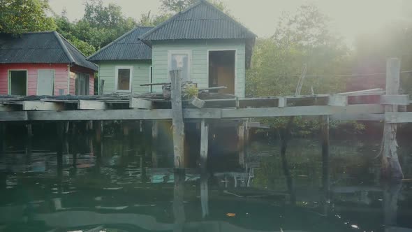 Travel Along the River Near a Bungalow in Thailand