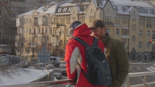 Man is Talking by Phone Other Man Comes Puts alt