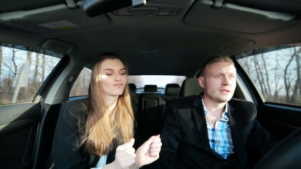 Young Couple In a Car Guy Nervous About Dancing Girl alt