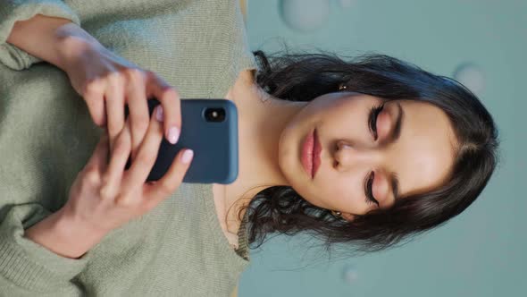 Woman Holding Smartphone and Writing a Message Chating in Social Media alt