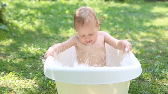 Baby Bathing In Garden