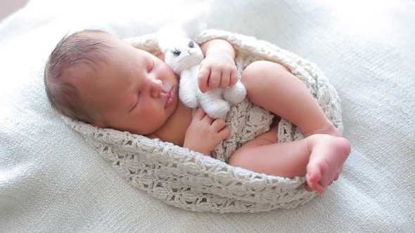 cute baby sleeping with teddy