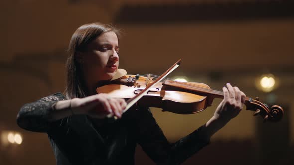 Inspired Female Violinist is Playing Melody in Symphonic Orchestra ...