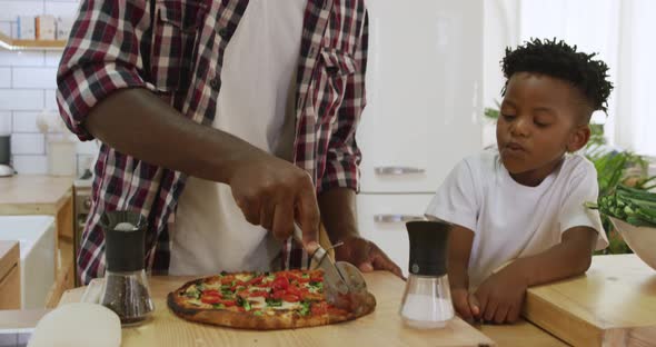 Father and son cooking together alt