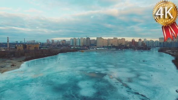 Flying on a Drone Over the Ice to the City