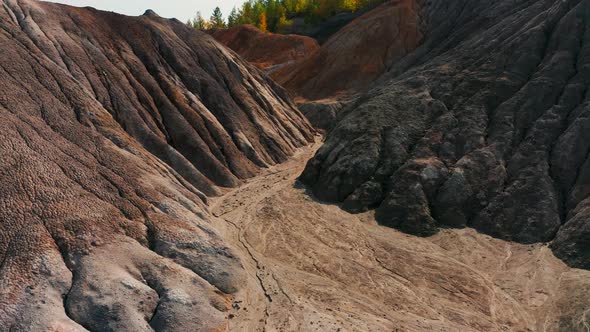 Aerial View of a Landscape Similar To the Planet Mars with Red Hills and Rivers with Red Water alt
