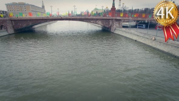 Cars and People go on Kremlin Embankment