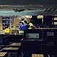 Worker in Uniform Going Along Shelves and Checking Cargo - VideoHive Item for Sale