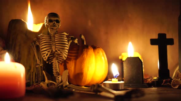 halloween concept with the human skull pumpkin and candle light dark horror alt