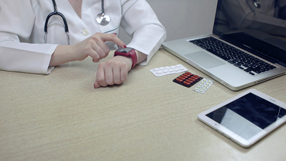 Woman Using A Smart Watch  alt