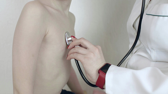 Doctor Checking A Patient Kid With Stethoscope