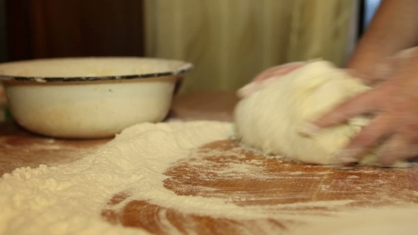 Woman Knead The Dough On The Table alt