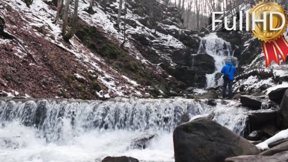 Photographer Making Photo of Winter Waterfalls