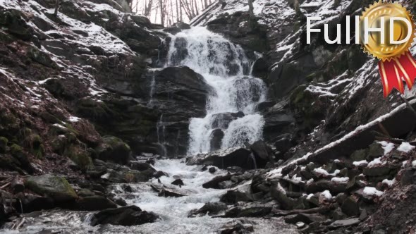 Fast Flowing Water in a Waterfall During Winter