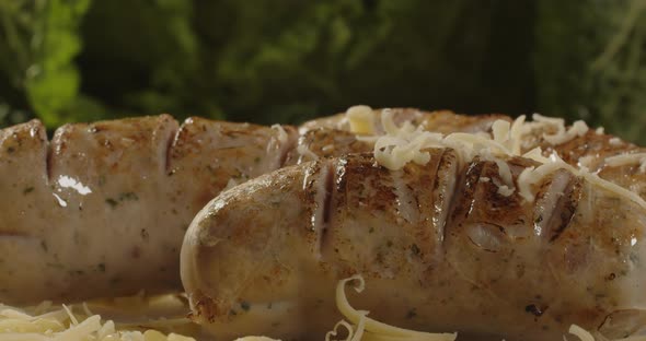 Grilled Sausages With Cheese Were Laid Out On A Plate. Serving A Meat Dish